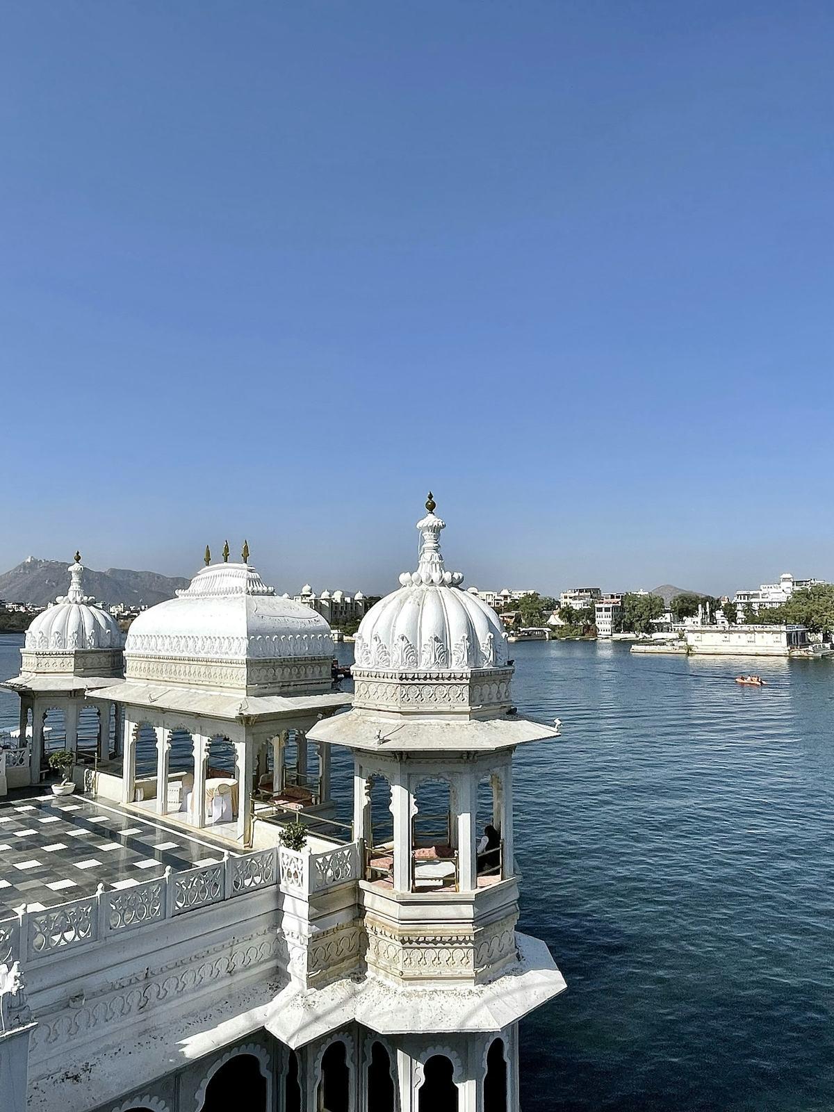White marble lake palace on a clear morning