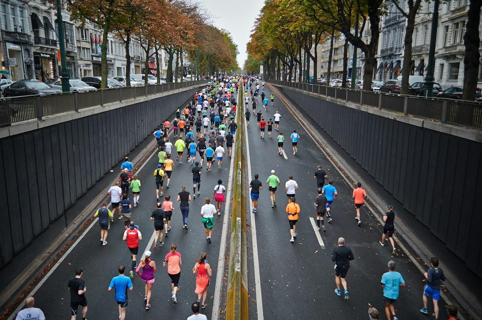 Aerial view of marathon runners on a city road