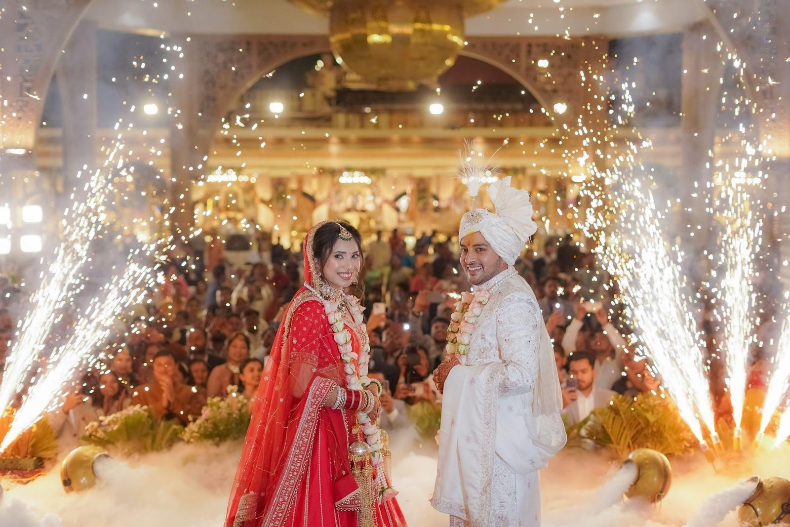 Bride and groom making their sangeet entry through cold pyros
